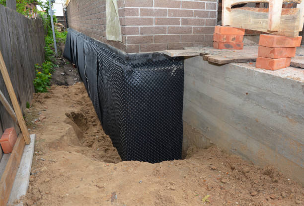 SJ Waterproofing Pros technician performing targeted Vapor Barrier Installation assessment in Ashley, IN